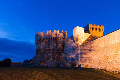 Low angle view of fort against blue sky