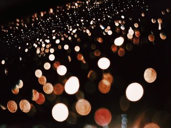 Defocused image of illuminated lights at night