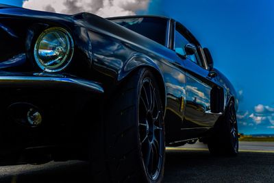 Vintage car parked against blue sky at night