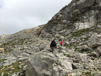 People climbing on rocky mountains