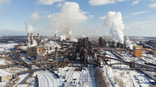 Panoramic view of cityscape against sky during winter