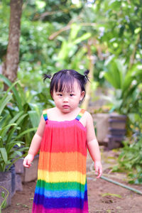 Portrait of cute girl standing outdoors