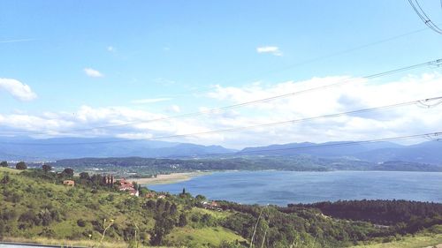 Scenic view of bay against sky