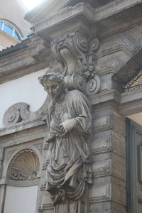 Low angle view of statue of historic building
