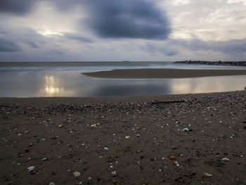 Scenic view of sea against sky at sunset