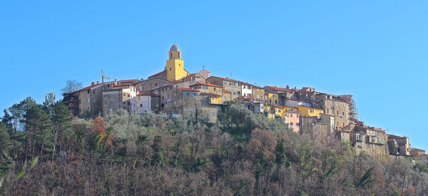 Low angle view of building against clear blue sky