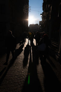 People walking on sidewalk in city