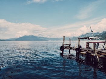 Jetty in sea against sky