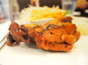 Close-up of meat on barbecue grill