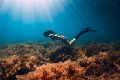 Man swimming in sea