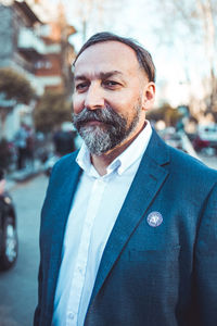 Mid adult man standing at home