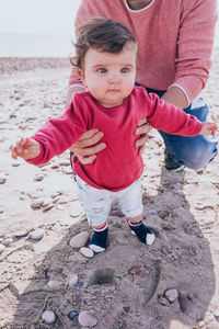 Father with baby standing outdoors