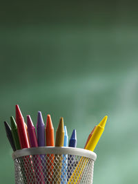 Close-up of colorful crayons in desk organizer