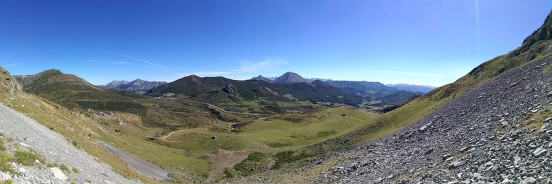 Scenic view of mountains against clear blue sky