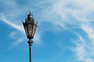 Low angle view of street light against sky