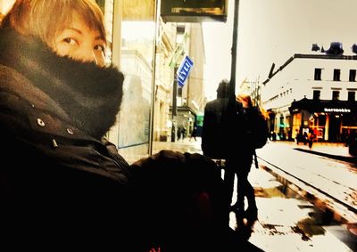 Woman standing in city