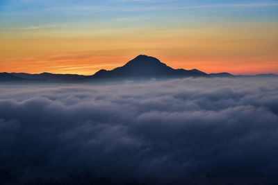 Scenic view of mountains against sky during sunset