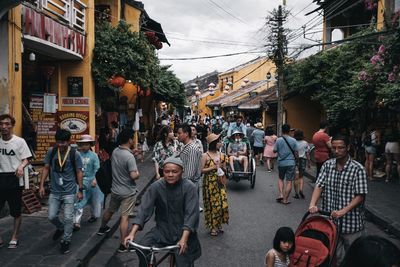 People walking on street in city