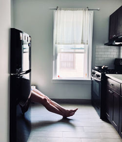 Male feet in the kitchen