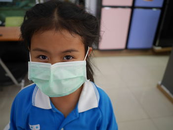 Portrait of girl wearing pollution mask