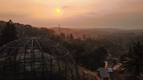 Panoramic view of cityscape against sky during sunset