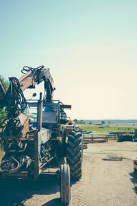 Traditional windmill on field against clear sky