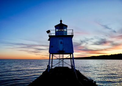 Lighthouse on lake superior during sunset