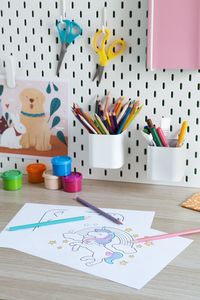 High angle view of school supplies on table