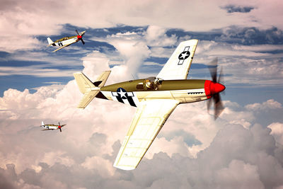 Low angle view of airplane flying against sky