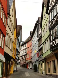 Street amidst buildings against sky