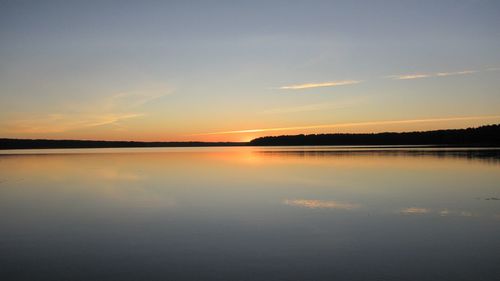 Scenic view of lake at sunset