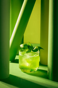 Close-up of gin basil smash cocktail in shades of green