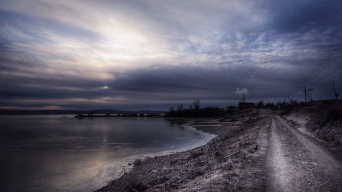 Scenic view of sea against cloudy sky