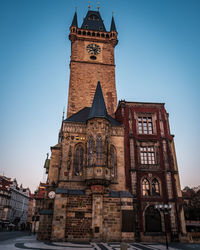 Low angle view of clock tower against sky
