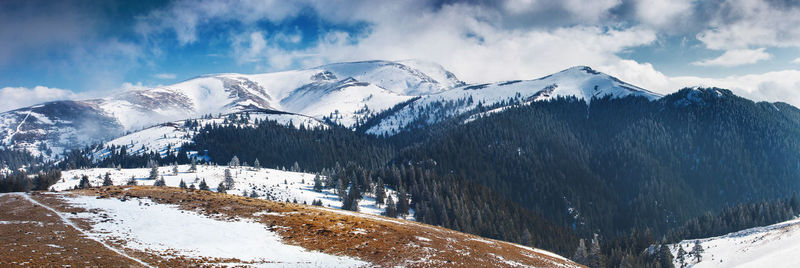 Scenic view of snowcapped mountains against sky