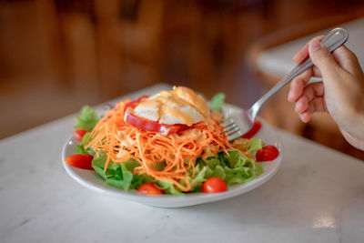 Close-up of man holding food