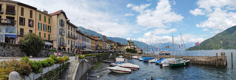 Panoramic view of river amidst buildings against sky