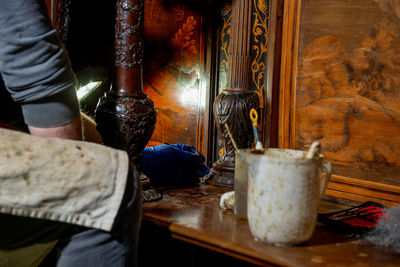 Low section of woman sitting on table