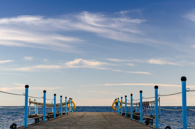 Pier over sea against sky