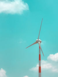 Low angle view of wind turbine against sky