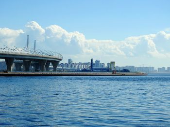 View of bridge over river against blue sky