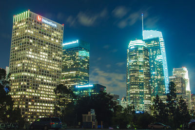 Low angle view of skyscrapers lit up at night