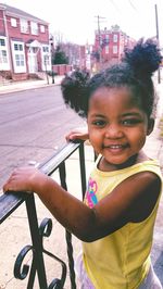 Portrait of smiling boy in city
