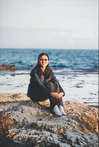 Woman sitting on beach