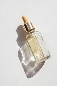 Close-up of bottle against white background