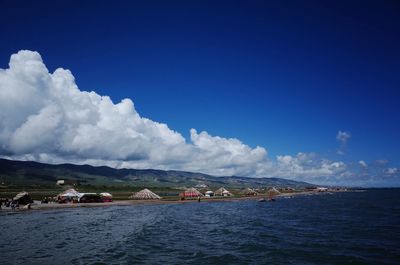 Scenic view of sea against blue sky