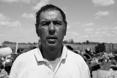 Portrait of man standing against sky