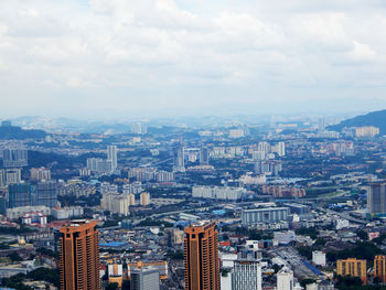 Aerial view of cityscape against sky