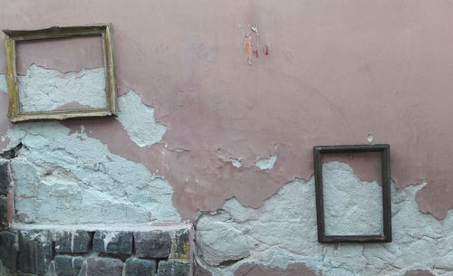 Close-up of abandoned window on wall