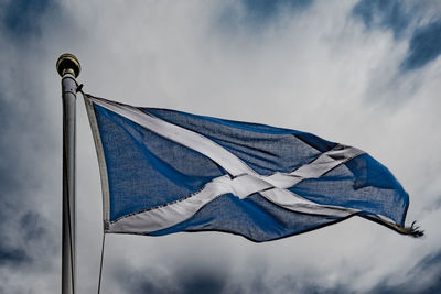 Low angle view of flag against sky